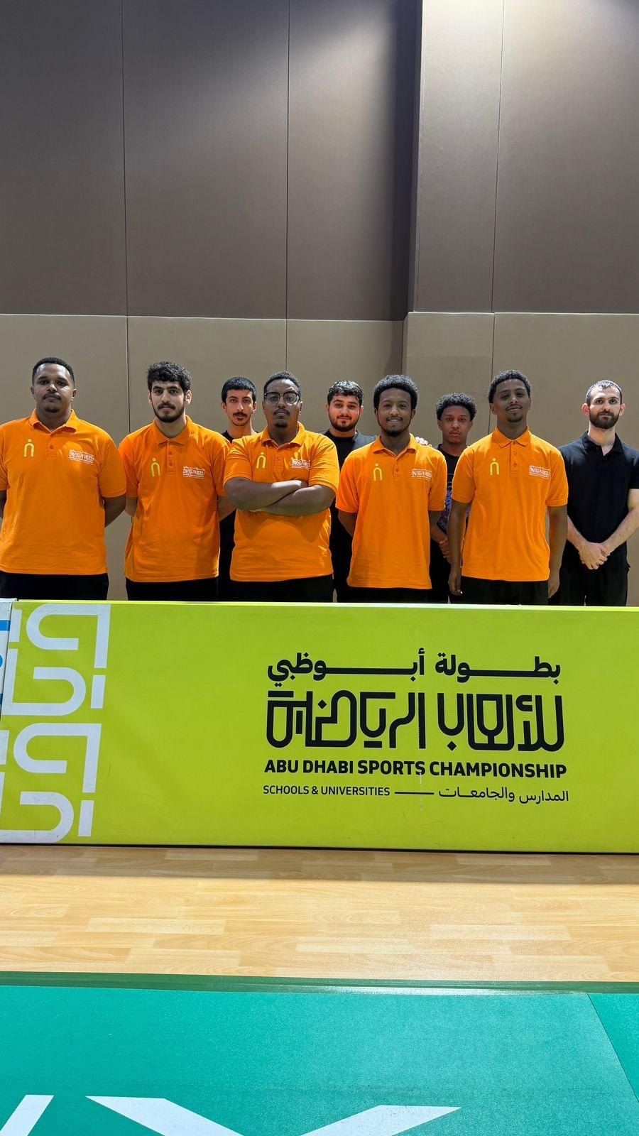 The crew behind the Abu Dhabi Sports Championship sign